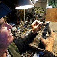 Yahgulaanas master carver and community leader, Christian White, carving argelyte in his studio.
Old Masset 2022